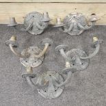 A set of five early 20th century cast iron wall lights