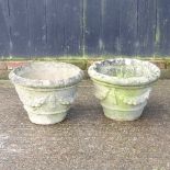 A pair of reconstituted stone planters