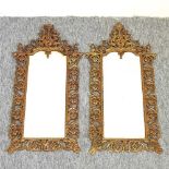 A pair of ornate 19th century brass framed wall mirrors