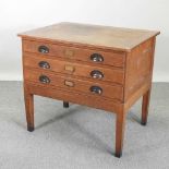 A 1920's oak plan chest, on stand