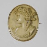 An antique carved lava cameo brooch