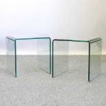 A pair of contemporary curved glass occasional tables