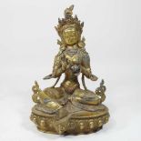 An Asian gilt bronze and cabochon figure of a seated Buddha,