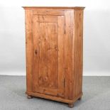 A stained pine cabinet