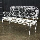 A white painted metal garden bench,