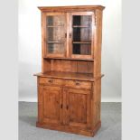 A pine cabinet bookcase