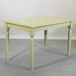 A modern rustic green painted dining table