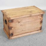 A modern pine and metal bound blanket box
