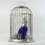 A modern claret jug, in the form of a blue glass and plated parrot