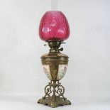 A 19th century Doulton brass mounted oil lamp