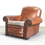 A 1920's brown leather upholstered club armchair