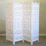 A white painted Eastern four fold dressing screen