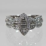 An 18 carat white gold and diamond cluster ring