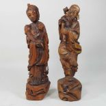 A pair of Chinese carved wooden figures,