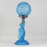 An Art Deco pressed blue glass table lamp and shade