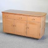 A 1970's Ercol light elm sideboard