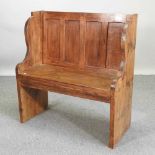 A rustic pine pew