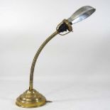 A mid 20th century flexible brass desk lamp