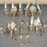 A set of four gilt twin branch wall sconces