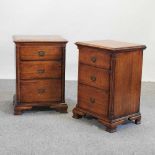 A pair of reproduction Georgian style oak bedside chests,