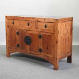 A 20th century Chinese pine sideboard