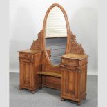 A stained pine pedestal dressing table