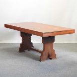 A mid 20th century teak refectory dining table