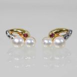 A pair of 18 carat two colour gold and pearl earrings