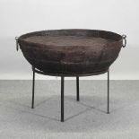 A very large metal fire pit,