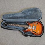 A Harley Benton semi acoustic electric guitar