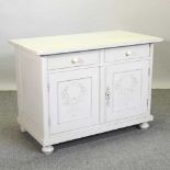 A cream painted pine cabinet