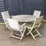 DAY 2 - A wooden circular garden table on a metal base