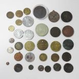 A collection of coins, medals and tokens