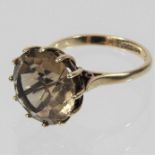 A 9 carat gold smoky quartz single stone ring