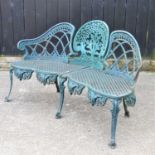 A green painted cast iron garden bench