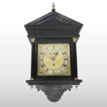 A George III style ebonised hood clock