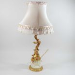 A gilt metal and marble figural table lamp