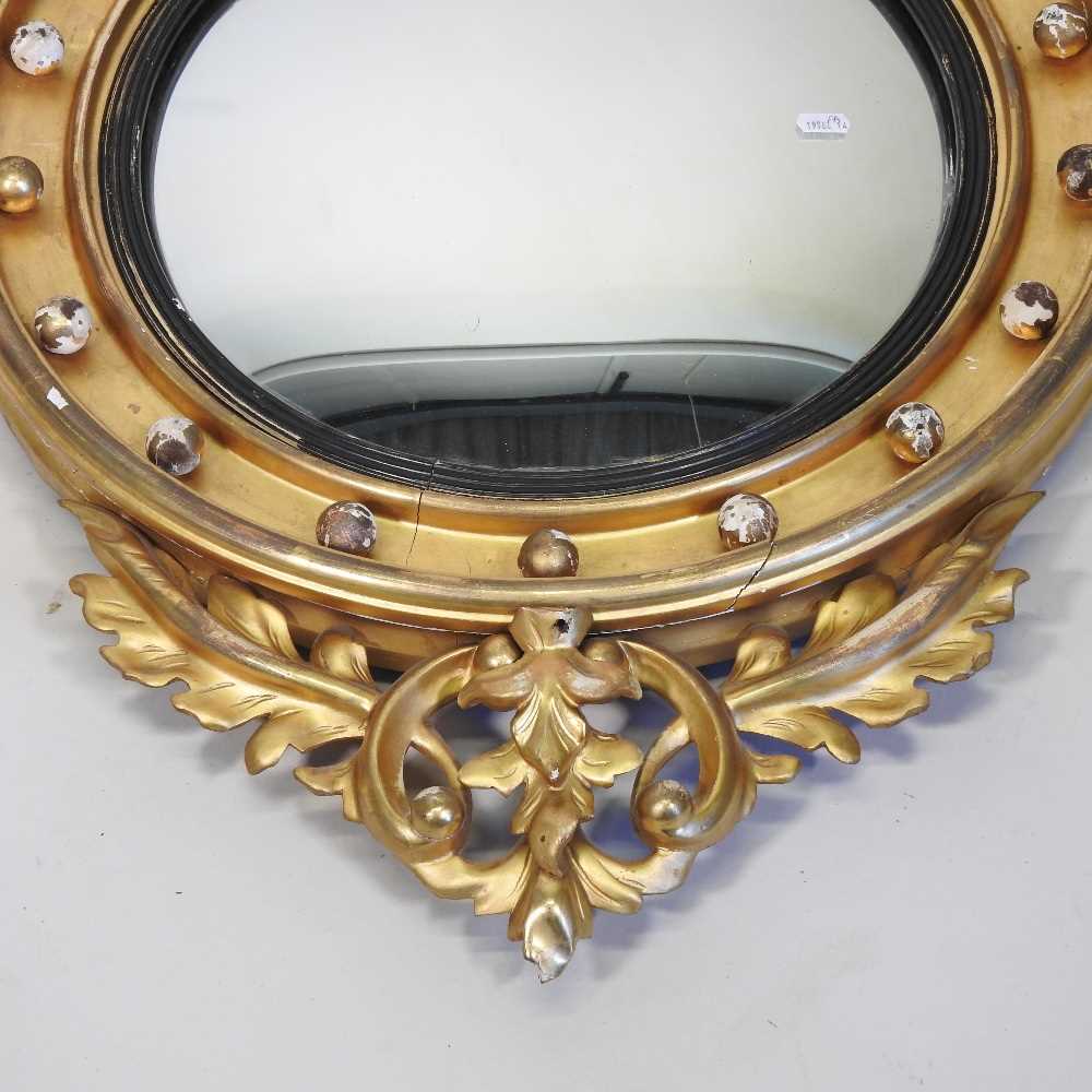 A Regency carved pine and gilt gesso framed convex wall mirror - Image 4 of 18