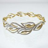 An 18 carat gold diamond set bangle