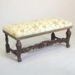 An early 20th century carved oak window seat