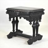 A 19th century heavily carved dark oak side table