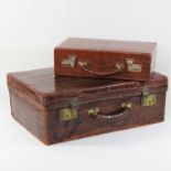 An early 20th century crocodile skin travelling case