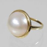 A 14 carat gold cultured pearl blister ring