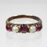 An unmarked ruby and cultured pearl ring