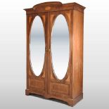 An Edwardian mahogany and inlaid double wardrobe