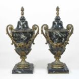 A pair of early 20th century marble urns