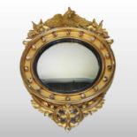 A Regency carved pine and gilt gesso framed convex wall mirror