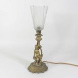 An early 20th century bronzed figural table lamp