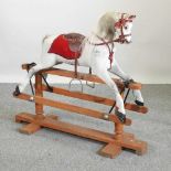 An early 20th century painted wooden rocking horse