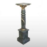 A green marble pedestal